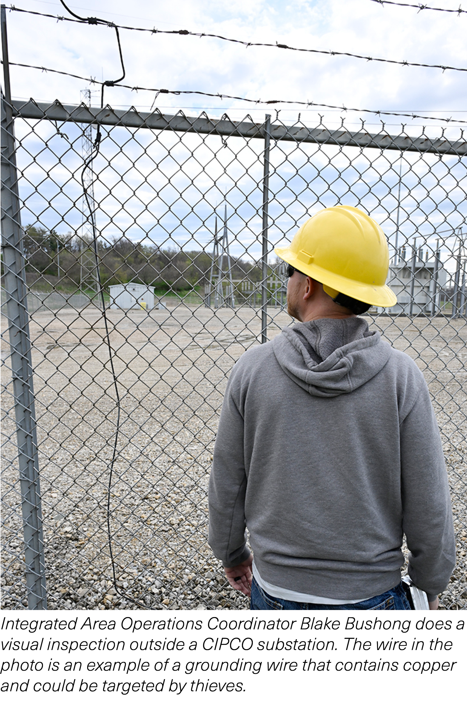 Blake Bushong inspecting substation